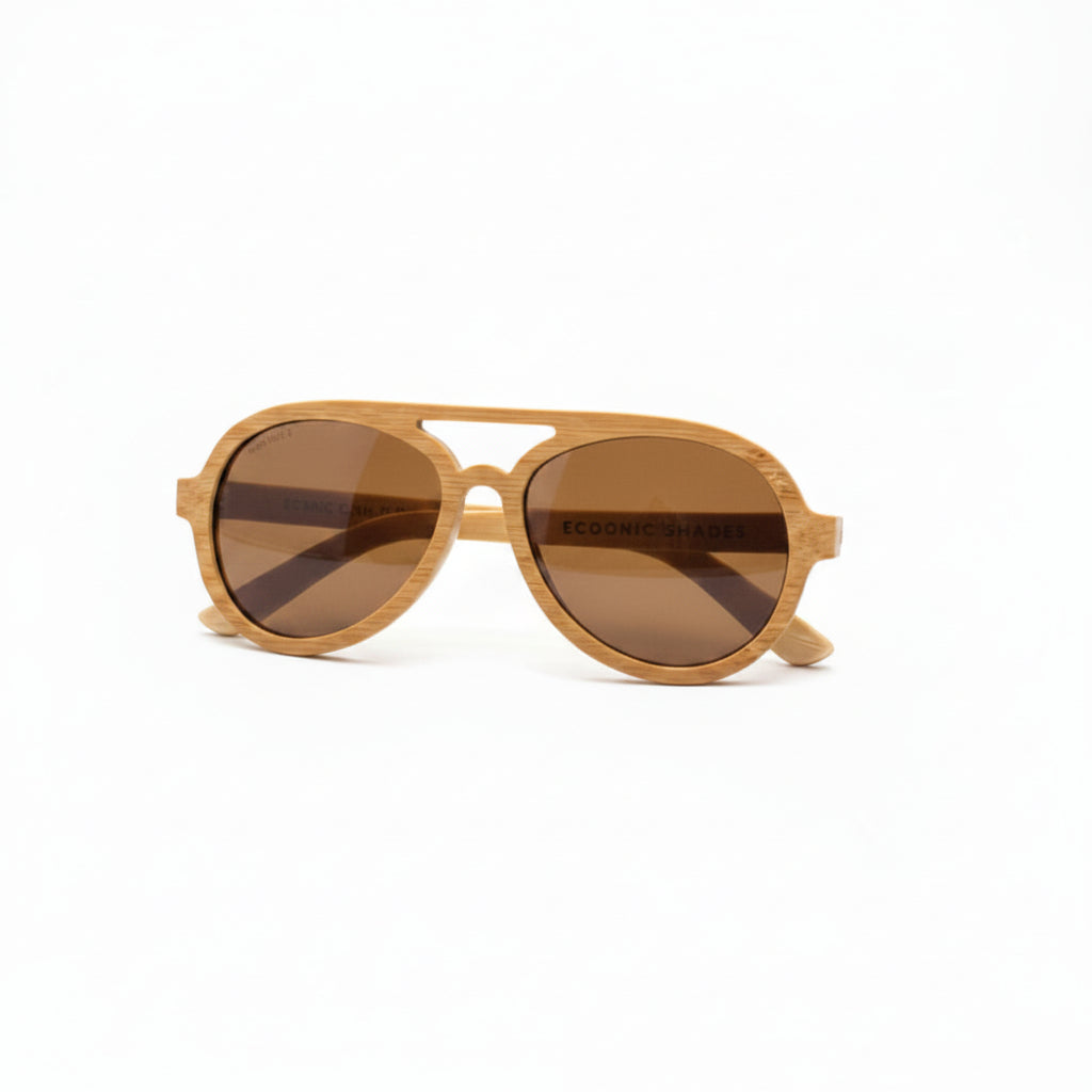 A pair of aviator-style sunglasses with a natural light brown bamboo frame and brown tinted lenses, shown on a plain white background.